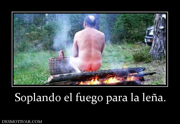 Soplando el fuego para la leña.
